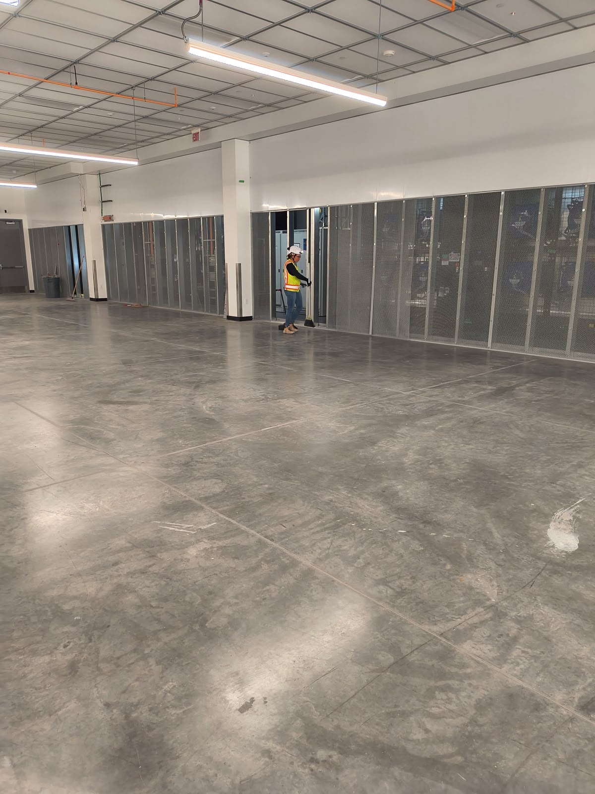 Prestige technician cleaning the floor inside a data center